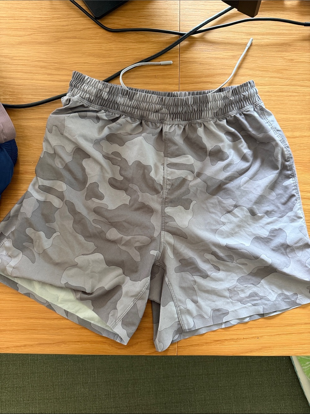 Men's Gray Camo 5” running shorts.